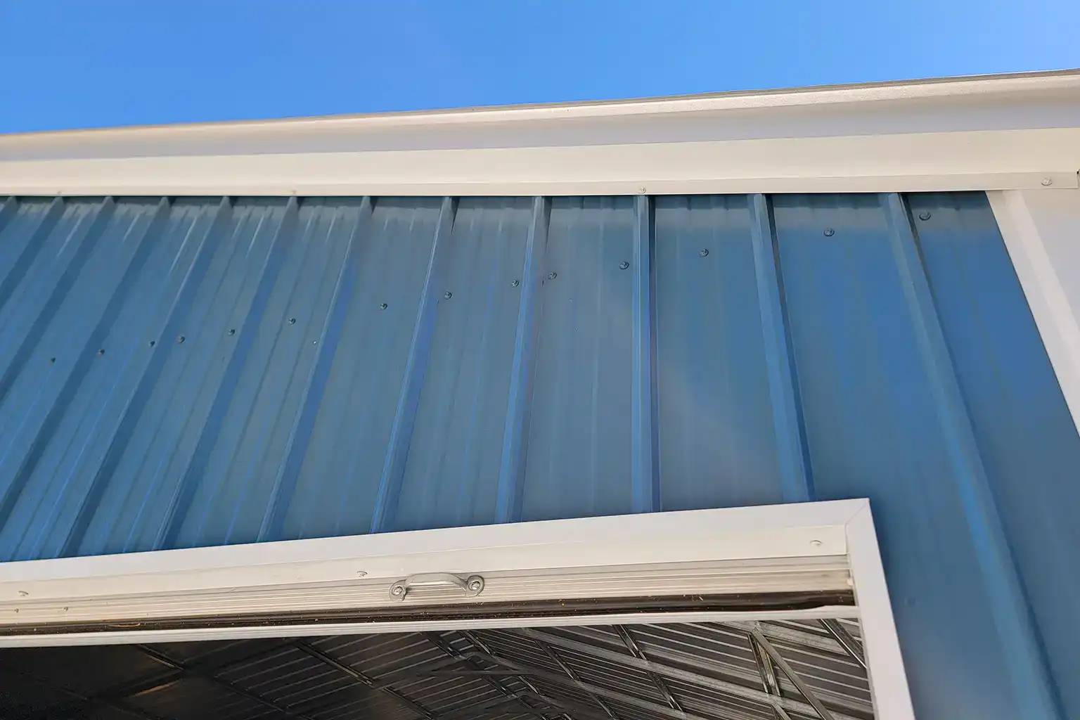 Closer (detailed) look at metal building trim around roof and door