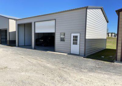 Exterior Of Two Car Metal Garage Door On The Right Side